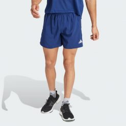Szorty Own The Run. Niebieskie krótkie spodenki sportowe męskie Adidas, s, bez wzorów, z materiału, do biegania. Za 179.00 zł.