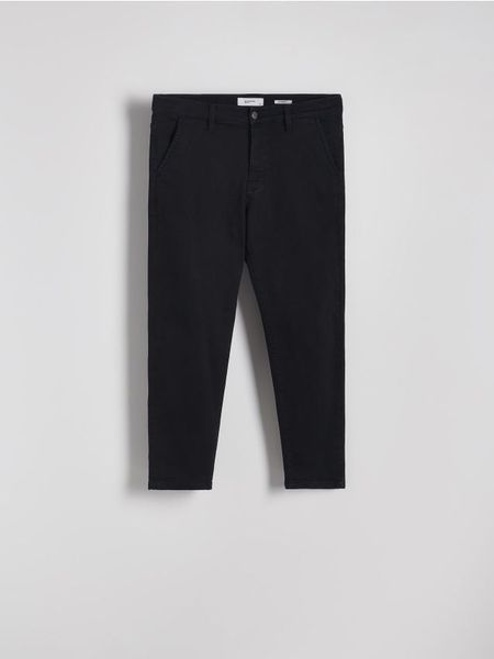 Jeansy carrot z efektem sprania - czarny. Czarne jeansy męskie Reserved. Za 159.99 zł.