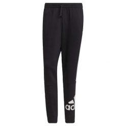 Spodnie adidas Essentials Colorblock Fleece. Białe spodnie sportowe męskie Adidas, s, bez wzorów, z bawełny, na fitness i siłownię. Za 173.45 zł.