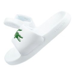 Klapki Lacoste Serve Slide W 02082 białe. Białe klapki damskie bez wzorów, z syntetyku, sportowe, bez obcasa. W wyprzedaży za 312.50 zł.
