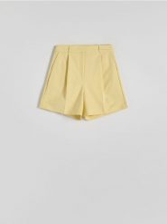 Szorty z kantem - jasnożółty. Żółte szorty damskie Reserved, l, bez wzorów, z tkaniny. W wyprzedaży za 59.99 zł.