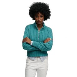 Damski pół-zamek sweter z warkoczowym splotem Superdry. Niebieskie swetry damskie Superdry., na zimę, bez wzorów, ze splotem, bez kołnierzyka, bez ramiączek, bez kaptura. Za 343.00 zł.