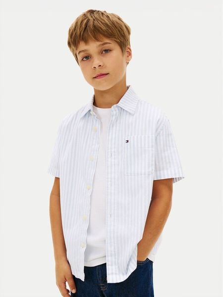 Tommy Hilfiger Koszula KB0KB10210 Niebieski jasny Regular Fit. Niebieskie koszule dla chłopców Tommy Hilfiger, bez wzorów, z bawełny, bez kołnierzyka, bez ramiączek. Za 172.99 zł.
