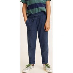 Mango Kids - Spodnie dziecięce Nico 110-164 cm. Niebieskie spodnie materiałowe dla chłopców Mango Kids, bez wzorów, z bawełny. W wyprzedaży za 39.90 zł.