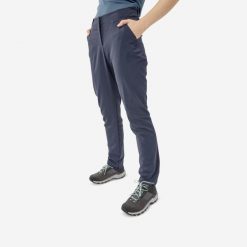 Spodnie turystyczne damskie Quechua MH100. Niebieskie spodnie sportowe damskie QUECHUA, l, bez wzorów, z materiału, trekkingowe. Za 89.99 zł.