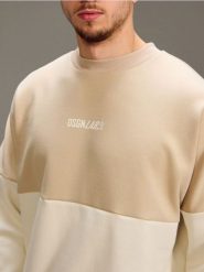 Bawełniana bluza crewneck z napisem - kremowy. Białe bluzy męskie Sinsay, l, bez wzorów, z bawełny, bez kaptura. Za 49.99 zł.