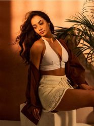 Swetrowa spódnica mini z wiązaniem - kremowy. Białe spódnice damskie Sinsay, l, bez wzorów, mini. Za 49.99 zł.