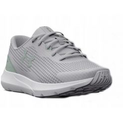 Buty biegowe damskie Under Armour W Surge 3. Szare obuwie sportowe damskie Under Armour, bez wzorów, do biegania. Za 159.99 zł.