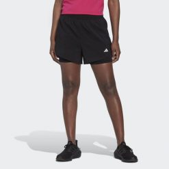 AEROREADY Made for Training Minimal Two-in-One Shorts. Białe szorty sportowe damskie Adidas, xs, bez wzorów, z materiału, sportowe, do biegania. Za 169.55 zł.