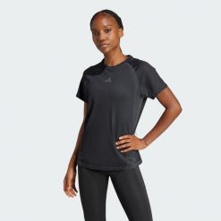 Bezszwowa koszulka z dzianiny. Czarne koszulki sportowe damskie Adidas, bez wzorów, z dzianiny, sportowe, bez kołnierzyka. Za 199.00 zł.