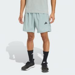 Tkane Szorty Do Ćwiczeń Essentials Base. Zielone krótkie spodenki sportowe męskie Adidas, bez wzorów, na fitness i siłownię, climacool (adidas). Za 119.00 zł.