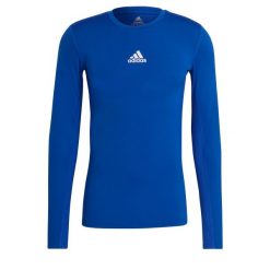 Koszulka męska adidas Compression Long Sleeve Tee. Niebieskie koszulki sportowe męskie Adidas, m, bez wzorów, bez kołnierzyka, bez ramiączek, na fitness i siłownię. Za 79.00 zł.