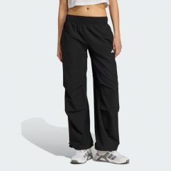 Spodnie treningowe Workout Essentials Woven. Czarne spodnie sportowe damskie Adidas, xl, bez wzorów, z elastanu, na fitness i siłownię, climacool (adidas). Za 219.00 zł.