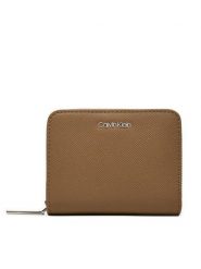 Calvin Klein Portfel Ck Must Md Zip Around_Caviar K60K612831 Beżowy. Brązowe portfele damskie Calvin Klein, bez wzorów, ze skóry. Za 159.99 zł.
