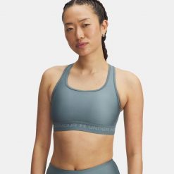Biustonosz Under Armour Crossback Mid. Niebieskie obuwie sportowe damskie Under Armour, bez wzorów, na fitness i siłownię. Za 149.99 zł.