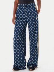Guess Spodnie dresowe V5YB10 K0282 Granatowy Relaxed Fit. Niebieskie spodnie dresowe damskie Guess, s, z aplikacjami, z dresówki. Za 329.99 zł.