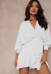 Biała Sukienka Barbeina. Białe sukienki damskie Renee, m, bez wzorów, bez kołnierzyka, bez ramiączek, mini, kopertowe. Za 129.99 zł.