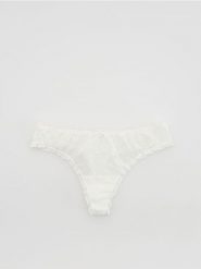 Majtki typu stringi z siateczki - złamana biel. Stringi damskie Reserved, l, bez wzorów. Za 19.99 zł.