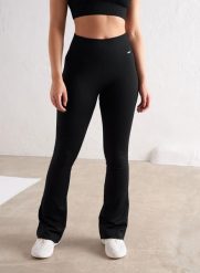 Damskie legginsy bezszwowe prążkowane rozszerzane wysoki stan squat proof czarne. Czarne legginsy damskie Aim'n, s, bez wzorów, z dzianiny, z podwyższonym stanem, na fitness i siłownię. Za 297.00 zł.