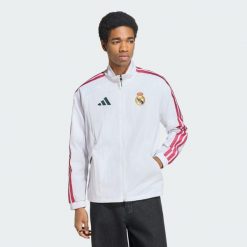Bluza reprezentacyjna z podstawowego kompletu Real Madryt. Białe bluzy męskie Adidas, l, bez wzorów, z dresówki, bez kaptura. Za 529.00 zł.
