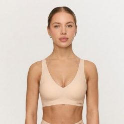 Biustonosz damski bezszwowy beżowy Comfy. Brązowe biustonosze GYMBEAM, bez wzorów, z elastanu. Za 63.90 zł.