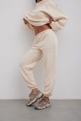 Spodnie typu jogger z HAFTEM w kolorze BISQUIT - NEVIS-XL. Brązowe spodnie materiałowe damskie Marsala, m, bez wzorów, z bawełny. Za 279.90 zł.