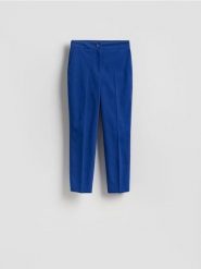 Spodnie w kant z bawełną - niebieski. Niebieskie spodnie materiałowe damskie Reserved, bez wzorów, z bawełny. Za 109.99 zł.