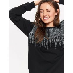 BLUZA DAMSKA NIEROZPINANA Z NADRUKIEM. Czarne bluzy damskie marki TROLL, na jesień, z nadrukiem, z dzianiny. W wyprzedaży za 54.99 zł.