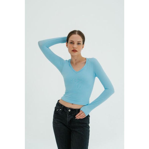 Longsleeve do jogi damski Moonholi NY Chic z długim rękawem. Niebieskie koszulki sportowe damskie MOONHOLI, bez wzorów, bez kołnierzyka, bez ramiączek, na jogę i pilates. Za 179.00 zł.