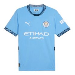 Męska Koszulka Domowa Puma. Niebieskie koszulki sportowe męskie MANCHESTER CITY, m, bez wzorów, bez kołnierzyka, bez ramiączek, trekkingowe. Za 477.99 zł.