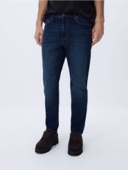 Jeansy carrot slim z efektem sprania - granatowy. Niebieskie jeansy męskie Reserved. Za 129.99 zł.