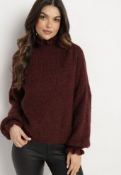 Brązowy Golf z Wiskozą i Wełną o Kroju Oversize z Falbanką przy Dekolcie Ninirae. Brązowe swetry damskie Born2be, bez wzorów, z jeansu, eleganckie, bez kołnierzyka, bez ramiączek, bez kaptura. Za 169.99 zł.