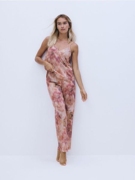 Spodnie od piżamy - brzoskwiniowy. Pomarańczowe piżamy damskie Reserved, l, bez wzorów, z bawełny, bez ramiączek. W wyprzedaży za 65.99 zł.