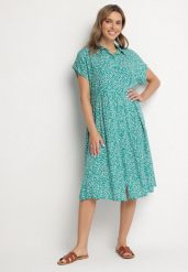 Ciemnozielona Bawełniana Sukienka Koszulowa w Kwiaty z Rozkloszowanym Dołem Jerilsa. Zielone sukienki damskie Born2be, na co dzień, l, bez wzorów, z bawełny, eleganckie, bez kołnierzyka, bez ramiączek, midi, koszulowe. Za 39.99 zł.
