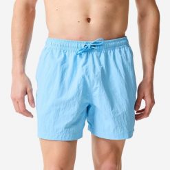 Spodenki surfingowe męskie Decathlon 100 Pomięte 15". Niebieskie kąpielówki męskie Decathlon, m, bez wzorów, z materiału, krótkie. Za 69.99 zł.