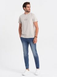 Spodnie męskie marmurkowe jeansowe JOGGERY - jasnoniebieskie V2 OM-PADJ-0133 - L. Niebieskie spodnie materiałowe męskie Ombre Clothing, l, bez wzorów, z bawełny. W wyprzedaży za 69.99 zł.