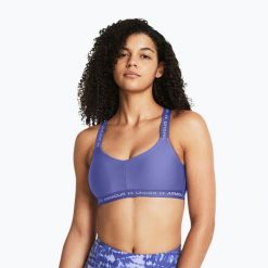Biustonosz Under Armour Crossback Low. Fioletowe obuwie sportowe damskie Under Armour, bez wzorów, na fitness i siłownię. Za 119.99 zł.