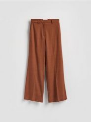 Spodnie z lnem - brązowy. Brązowe spodnie materiałowe damskie Reserved, l, bez wzorów, z tkaniny. Za 219.99 zł.