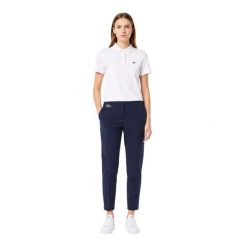Spodnie turystyczne damskie Lacoste Chino. Niebieskie spodnie sportowe damskie Lacoste, uniwersalny, z aplikacjami, z materiału, trekkingowe. Za 367.00 zł.