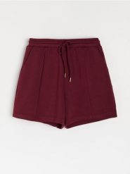 Szorty dresowe z wiązaniem - czerwony. Czerwone szorty damskie Sinsay, l, bez wzorów, z dresówki. Za 35.99 zł.