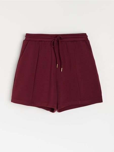 Szorty dresowe z wiązaniem soft touch - bordowy. Czerwone szorty damskie Sinsay, l, bez wzorów, z dresówki. Za 35.99 zł.