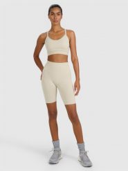 4F Legginsy kolarki treningowe bezszwowe damskie - beżowe M/L. Brązowe legginsy damskie 4f, l, bez wzorów, z dzianiny, z podwyższonym stanem, krótkie, na fitness i siłownię. Za 119.99 zł.