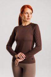 Koszulka treningowa bezszwowa damska z długim rękawem Dakota. Czerwone koszulki sportowe damskie Make Us Strong, s, bez wzorów, z materiału, bez kołnierzyka, bez ramiączek, na fitness i siłownię. Za 124.99 zł.
