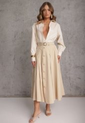 Beżowa Rozkloszowana Spódnica z Kieszonkami i Paskiem z Klamrą Qualea. Brązowe spódnice damskie Renee, l, bez wzorów, z bawełny, eleganckie, midi, dopasowane. Za 119.99 zł.