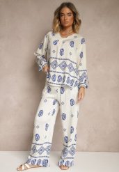 Biało-Niebieski Komplet w Stylu Etno Spodnie z Gumką w Pasie i Bluzka Oversize Eviralyn. Białe bluzki damskie Renee, bez wzorów, eleganckie, bez kołnierzyka, bez ramiączek. Za 89.99 zł.