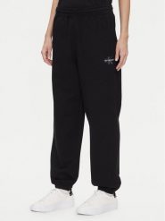 Calvin Klein Jeans Spodnie dresowe Monologo LV047B235G Czarny Regular Fit. Czarne spodnie dresowe damskie Calvin Klein Jeans, xl, bez wzorów, z bawełny. Za 269.99 zł.