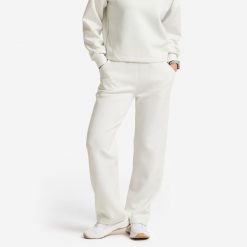 Spodnie dresowe damskie Gym & Pilates. Białe obuwie sportowe damskie Decathlon, l, bez wzorów, z dresówki. Za 129.99 zł.