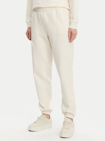 DKNY Sport Spodnie dresowe DP5P3585 Beżowy Regular Fit. Brązowe spodnie dresowe damskie DKNY Sport, m, bez wzorów, z dresówki. Za 179.99 zł.