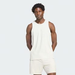 KOSZULKA BEZ RĘKAWÓW PUREMOTION RIBBED. Szare koszulki sportowe męskie Adidas, l, bez wzorów, z elastanu, bez kołnierzyka, bez ramiączek, na fitness i siłownię, climacool (adidas). Za 179.00 zł.