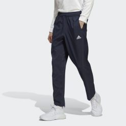 Spodnie AEROREADY Essentials Stanford Open Hem Embroidered Small Logo. Niebieskie spodnie sportowe męskie Adidas, s, bez wzorów, z materiału, na fitness i siłownię. W wyprzedaży za 158.95 zł.